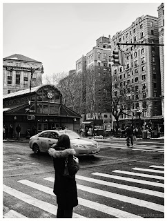 A woman hailing a cab in New York City