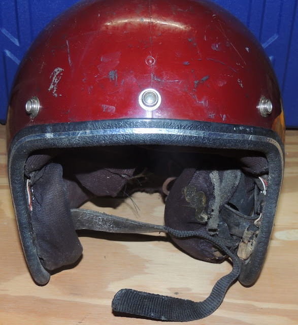 Front view of battered red helmet