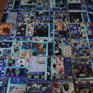 Blocks laid on the floor made from Star Wars fabric.