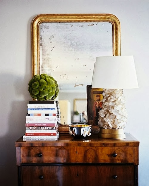 vignette styling chest table oversized gold mirror and accessories 