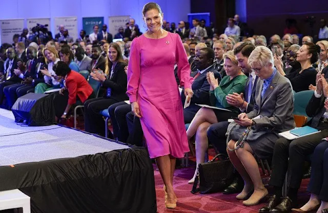 Crown Princess Victoria wore a new pespoke pink Lucia crepe dress by Swedish designer Camilla Thulin. By Malina Aimee dress