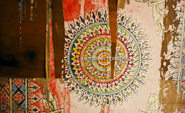 Damaged manadala mural painting at a Lao temple