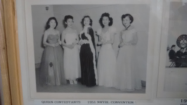 Five young Japanese American woman pose in formal dresses