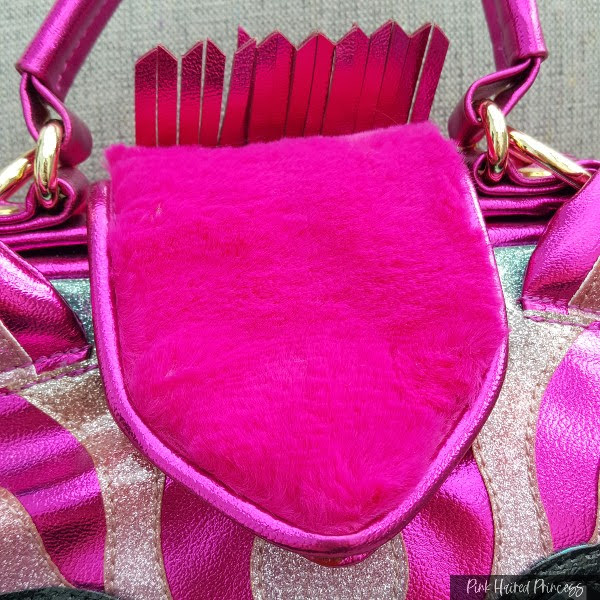 bright pink fur flap on bag