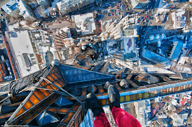 Man standing on top of the building 
