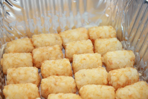 Butter casserole dish. Line the dish with tater tots.