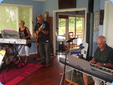 Jan and Kevin Johnston playing their lively music with John Perkin accompanying on digital piano