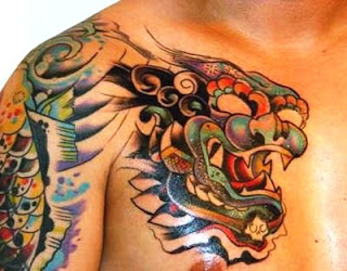 http://allaboutbodyart.blogspot.com/ - Lion Tattoo half sleeve tattoo design japanese lion tattoo for men