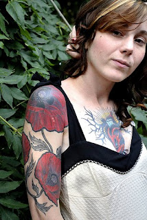 Flower tattoo design on up arm