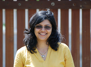 Head and shoulders image of author Harini Nagendra, an Indian woman with shoulder length dark brown hair and who is wearing sunglasses.