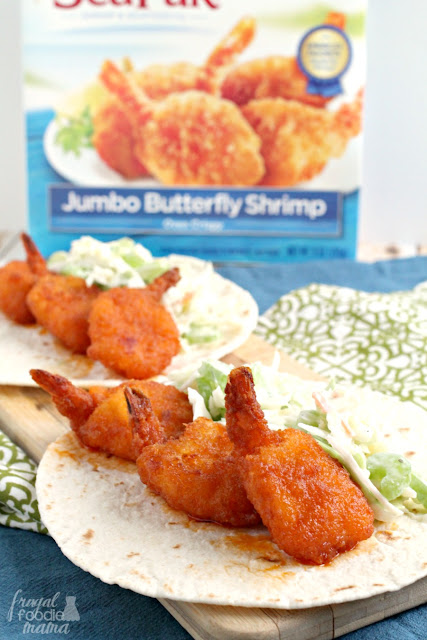 Crispy breaded shrimp are tossed in a homemade honey buffalo sauce & then wrapped up in warm flour tortillas with a creamy Ranch coleslaw in these Honey Buffalo Butterfly Shrimp Tacos.