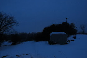 covered travel trailer in blue dusk