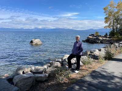 standing by the lakeshore of Tahoe