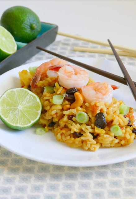 This easy 30 minute Shrimp Pineapple Fried Rice is delicious and such a great way to use leftover rice! This Thai inspired recipe gets it's flavors from pineapple, nuts, curry and raisins, along with vegetables and shrimp. Also great with chicken and so much better than takeout!