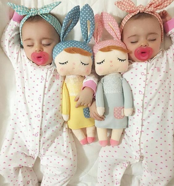 Cute Twin Baby Sleeping with Dolls