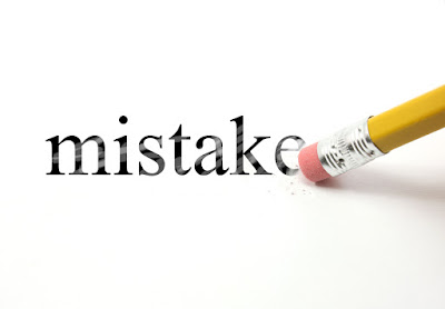 picture of a pencil eraser about to erase the word "mistakes"