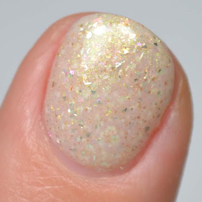 ivory crelly nail polish with shimmer swatch