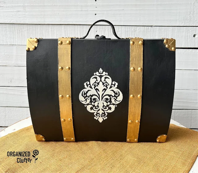 Photo of an upcycled Goodwill wooden suitcase.
