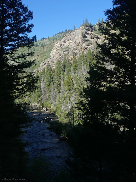 51: river in shadow and rock on the far side