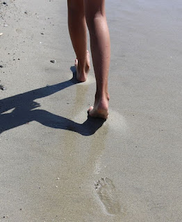 walking barefoot along the beach