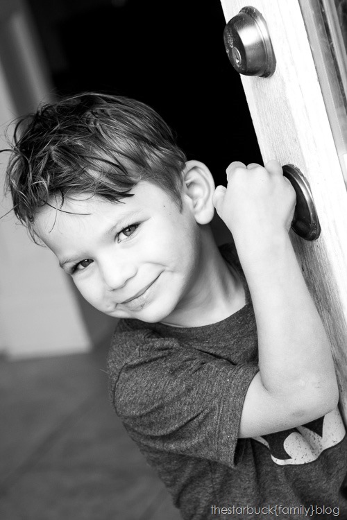 Ryan standing by door black and white blog-1