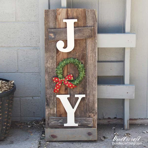 Use reclaimed fence wood to make a JOY holiday porch or front door sign