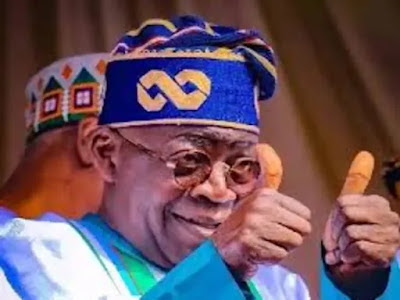 President tinubu with his two thumb