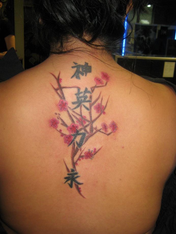 Japanese Character Tattoo and beautiful flower on the back