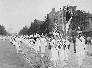 Ku Klux Klan members march down Pennsylvania Avenue in Washington, D.C. in 1928.