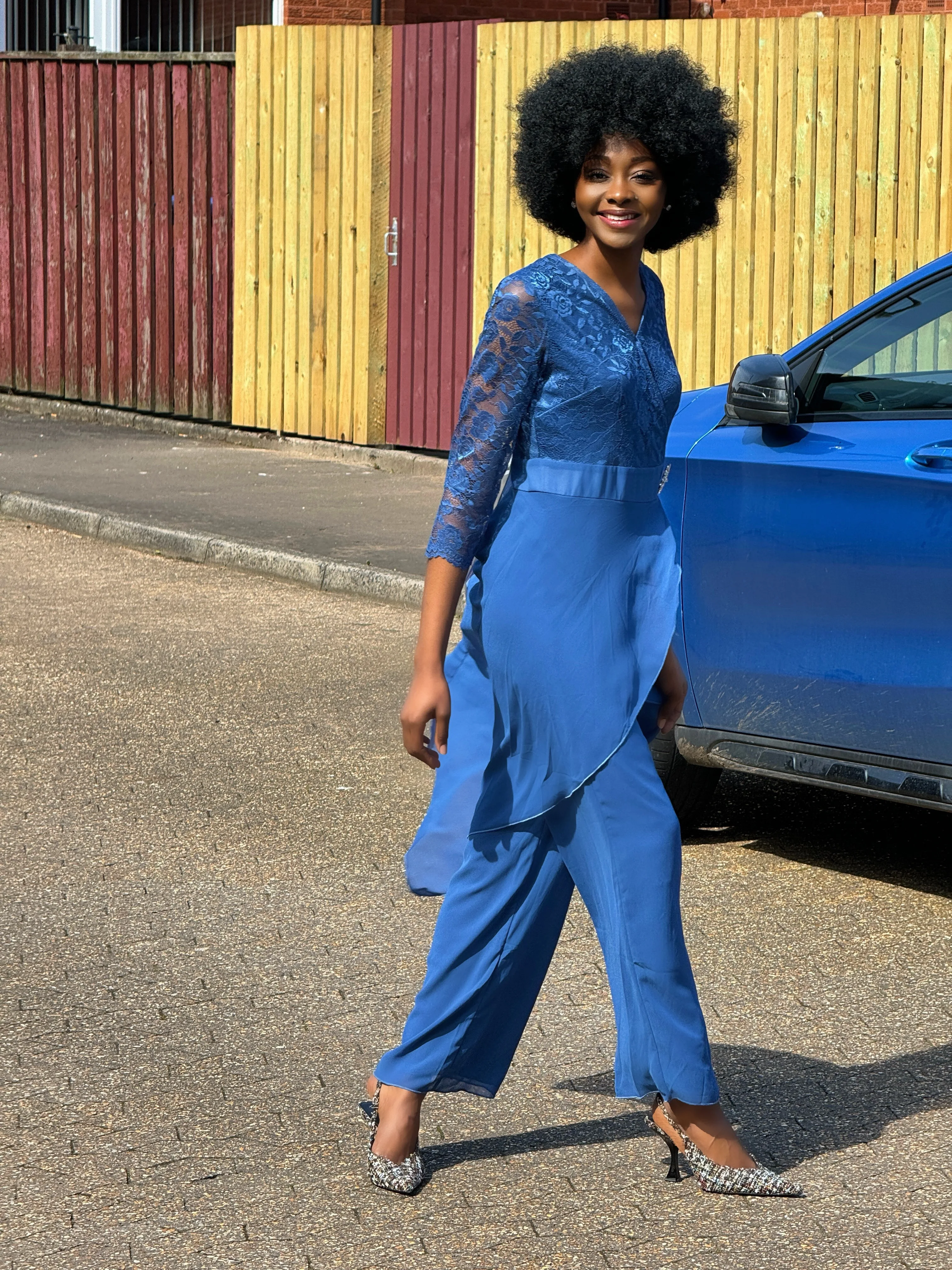 How to style a blue lace jumpsuit for a cocktail occasion