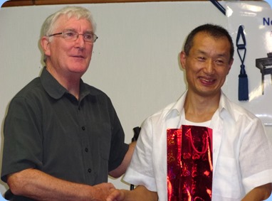 President, GordonSutherland, presenting Takashi with a gift as a thnak you for his wonderful performance on his Yamaha Electone Stagea organ. Photo courtesy of our new Secretary, Delyse Whorwood.