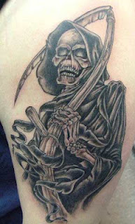 Black and white Grim Reaper tattoo