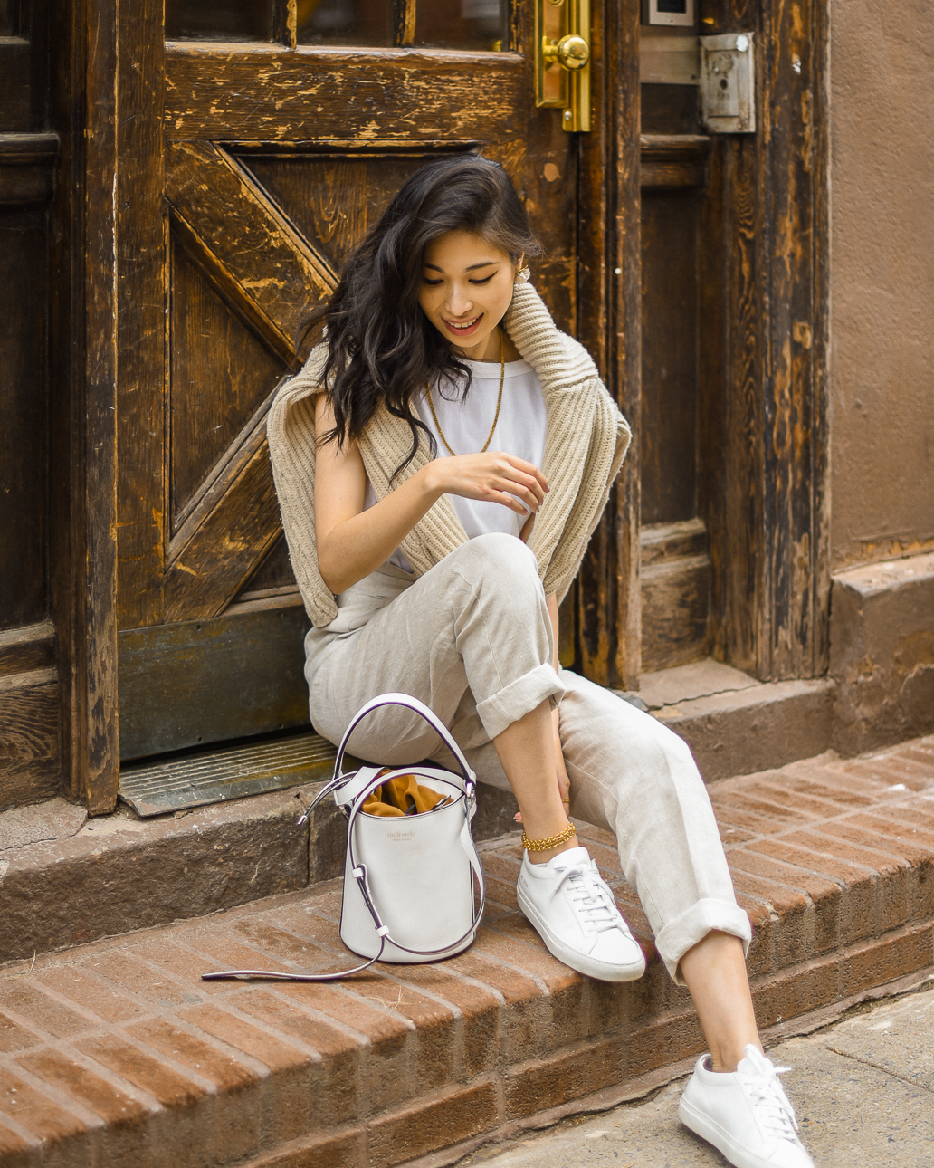 Belted linen trouser with ribbed knit sweater, Spring casual style, neutral spring outfits in New York, white bucket bag outfit ideas, Spring outfits layering, transitional style - FOREVERVANNY.com