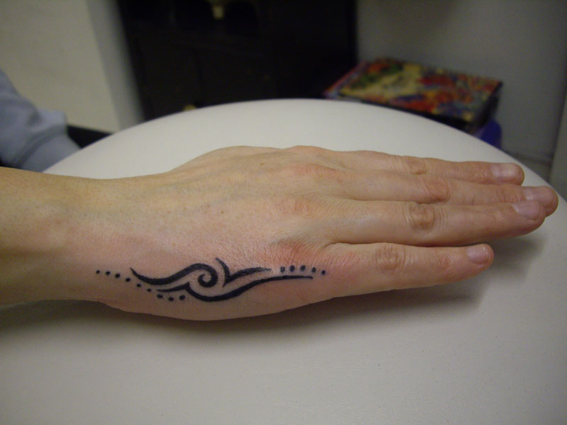  hand Tattoos we do have elements of tribal swirls flowers and stars so 