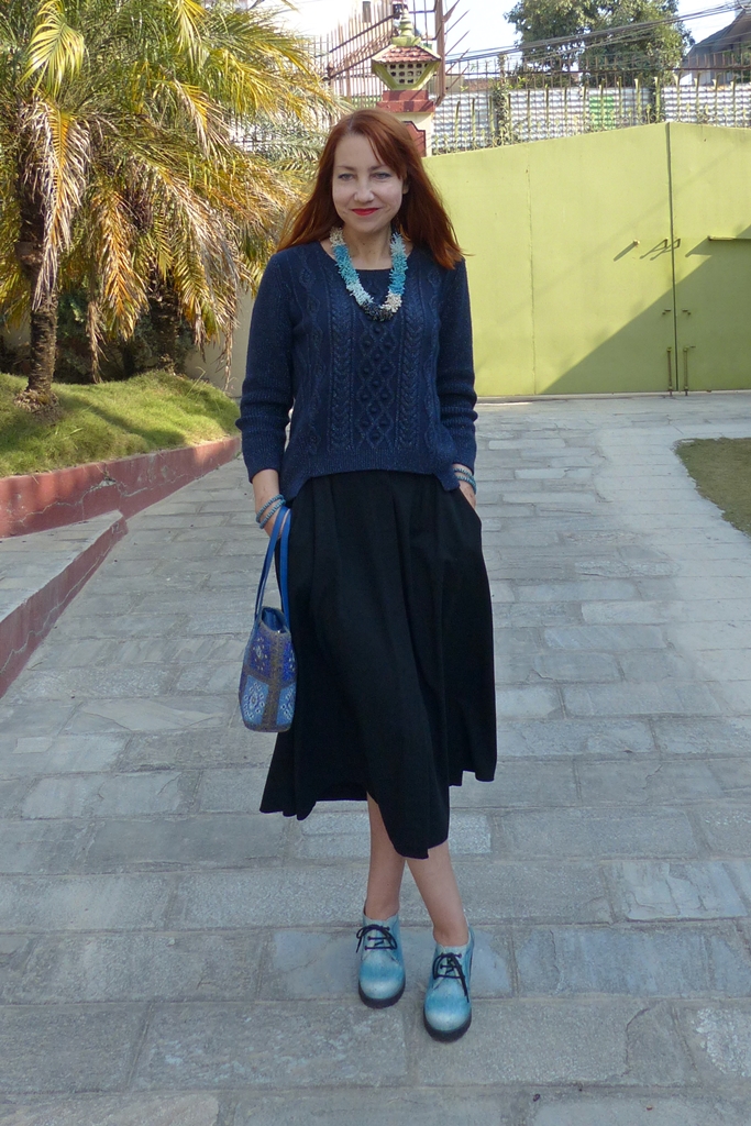 Lurex sweater with button down skirt and glass beads accessories 