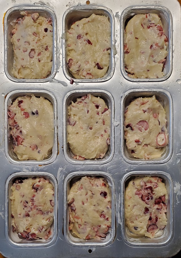 mini loaf muffin pan with zucchini raspberry batter