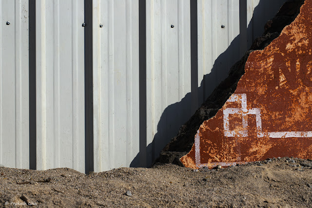 A Minimalist Photograph of an Orange Triangle at a Construction site in Jaipur.