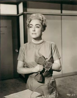 Joan Crawford one glove on, one glove off photograph