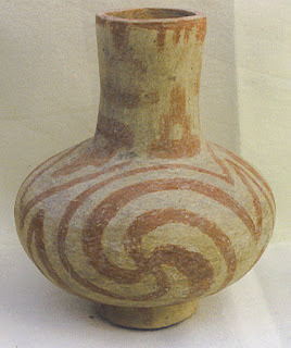 Nodena phase Mississippian culture pottery with spiral swastikas.