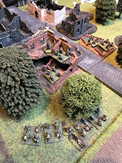 The British attackers get ready for an assault on the hamlet