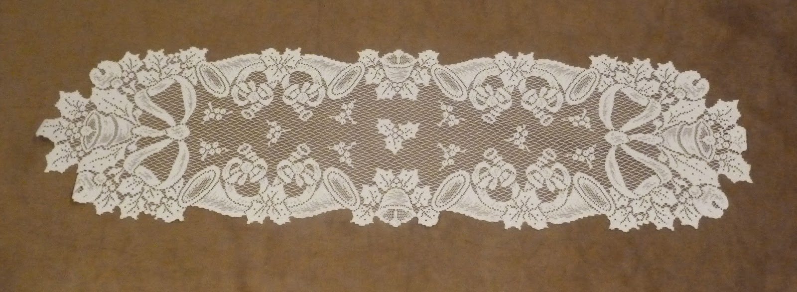 http://www.ebay.com/itm/Christmas-Holiday-Table-Runner-Heritage-Lace-White-14-x-70-NWOT-/151245447325