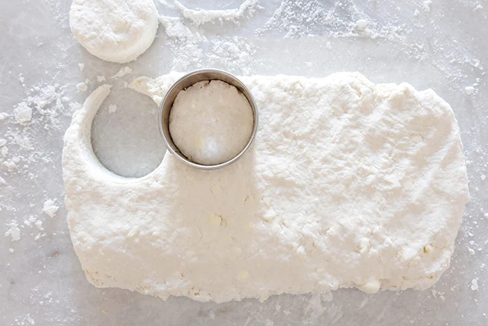 cutting biscuit rounds out of dough