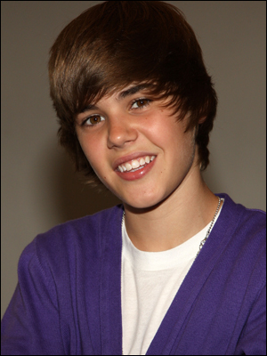 justin bieber smiling with his new haircut. justin bieber photoshoot 2010.