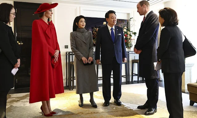 Princess of Wales wore a scarlet cape dress by Catherine Walker and a hat designed by Jane Taylor. First Lady Kim Keon Hee