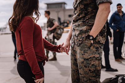 Marine and Wife reuniting at their homecoming after a long deployment at Marine Core Air Station Miramar with VMFA 225 by Morning Owl Fine Art photography San Diego.