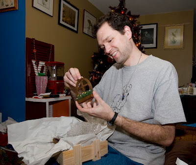 John examines the fairy window Beth gave him