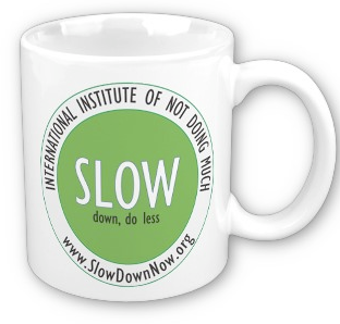 coffemugthat says Slow Down, Do Less