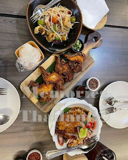 Several Thai dishes served with the real sticky rice and delicious spicy sauces