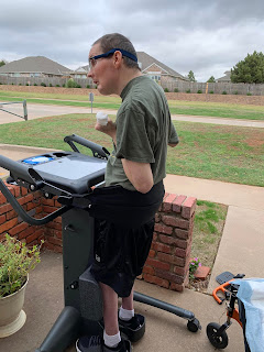 Chris in the standing frame out on the front patio