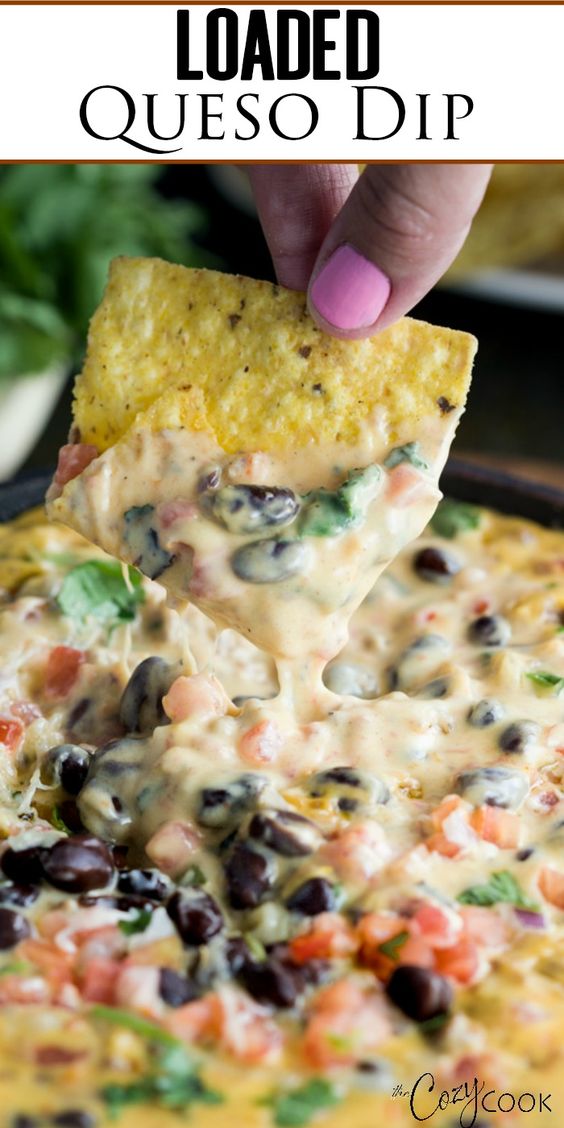 This easy Homemade Queso Dip is loaded with warm Velveeta, pepper jack cheese, beef, pale ale, Rotel tomatoes, black beans, and fresh cilantro.